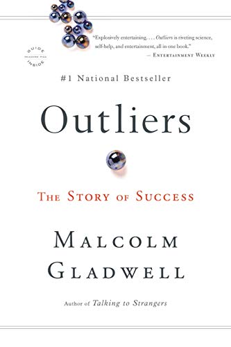 White book cover with the title Outliers in black and the words The Story of Success in orange. Beneath the title are the words Malcolm Gladwell in black.  
